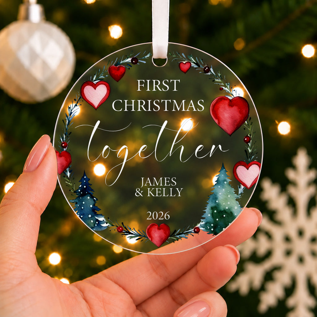 Personalised First Christmas Together Bauble – Heart Wreath Design – shown held in the hand