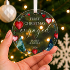 Personalised First Christmas Engaged Bauble – Heart Wreath Design – shown held in the hand