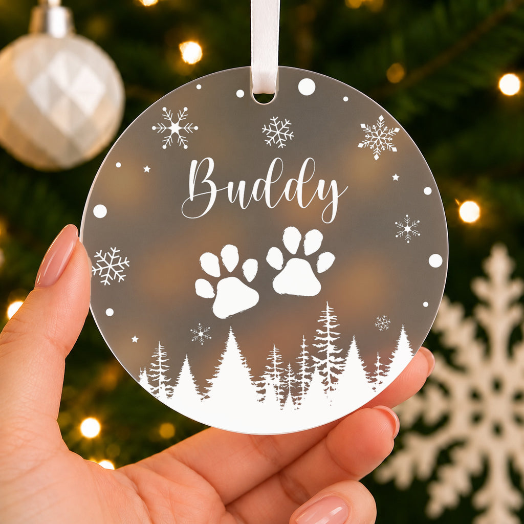 Personalised Pet Name Christmas Bauble – Paw Prints & Snowflakes – shown held in the hand