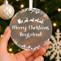 Personalised Boyfriend or Girlfriend Christmas Bauble – Santa Sleigh Design – shown held in the hand