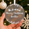 Personalised Brother or Sister Christmas Bauble – Santa Sleigh Design – shown held in the hand
