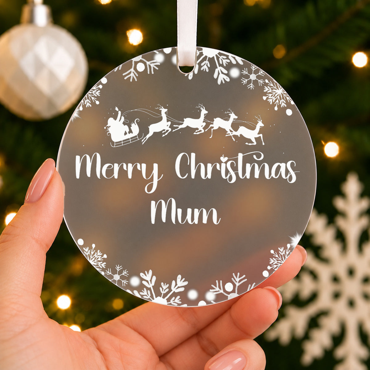 Personalised Mum & Dad Christmas Bauble – Santa Sleigh Design – shown held in the hand