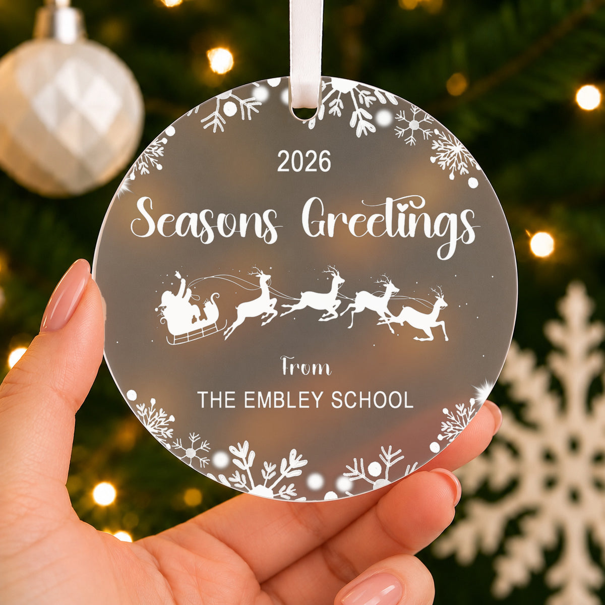 Personalised Seasons Greetings Bauble 2026 – Company & Staff Christmas Gift – shown held in the hand