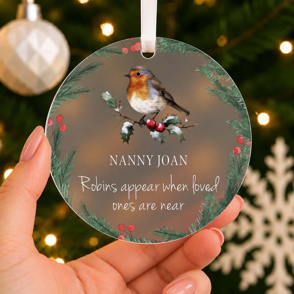 Personalised Robin Memorial Christmas Bauble – When Robins Appear – shown held in the hand