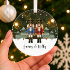 Personalised Nutcracker Couple Christmas Bauble – Both Names – shown held in the hand