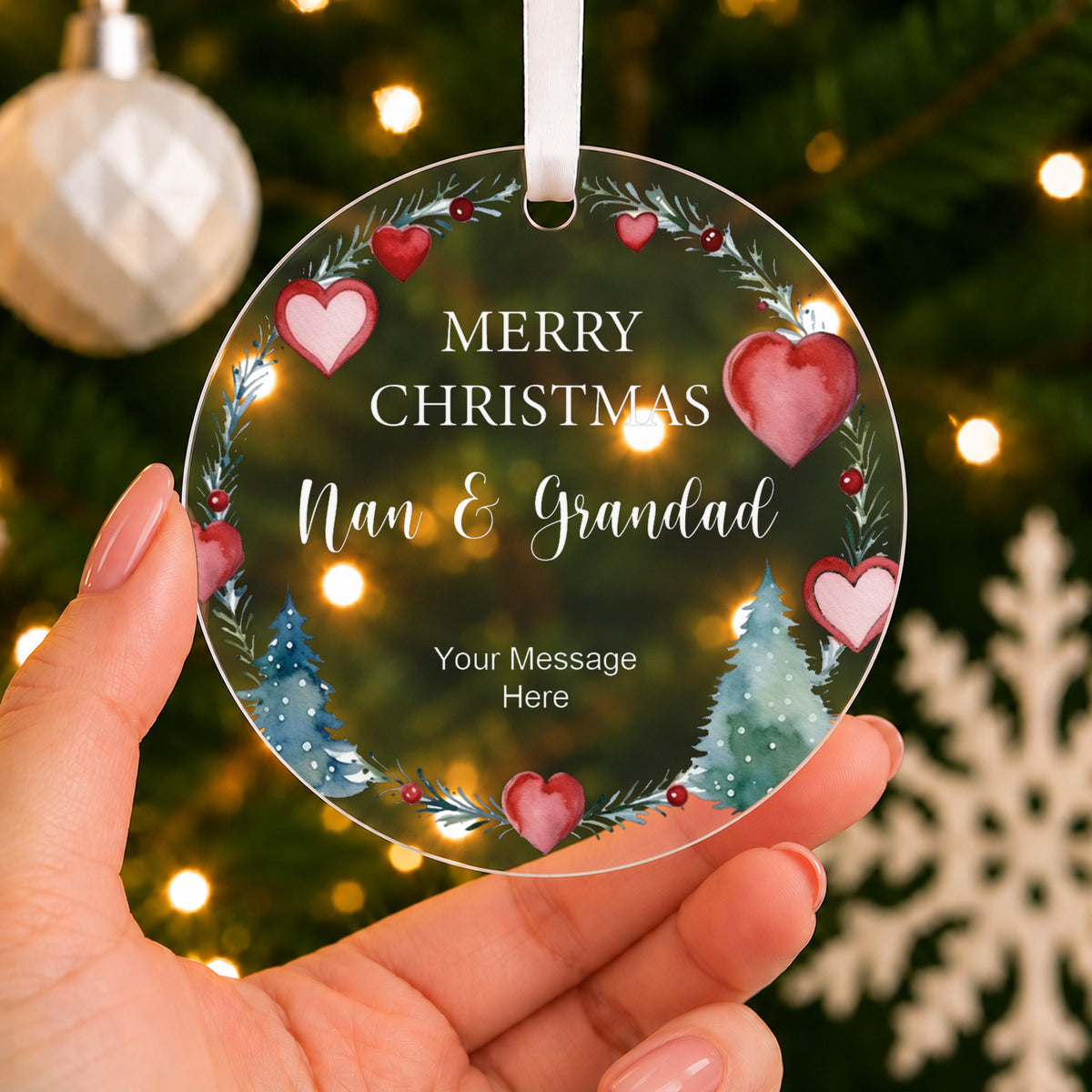 Personalised Couple's Christmas Bauble – Heart Wreath for Nan & Grandad – shown held in the hand