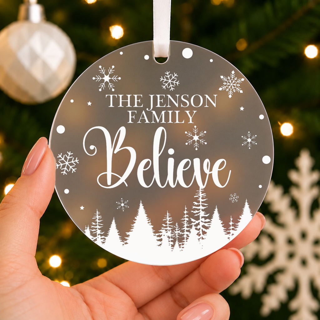 Personalised Family Believe Christmas Bauble – Family Name – shown held in the hand