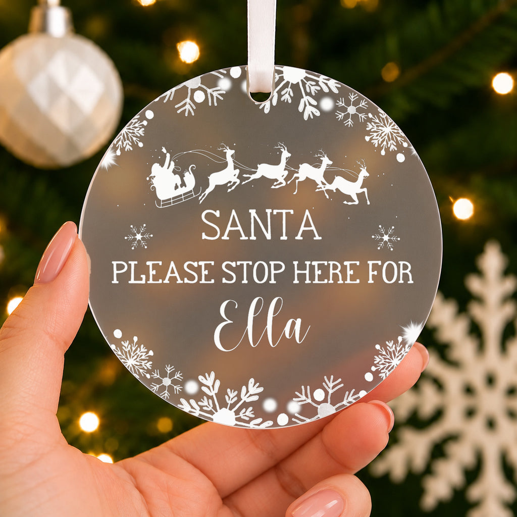 Personalised Santa Please Stop Here Christmas Bauble – Child's Name – shown held in the hand