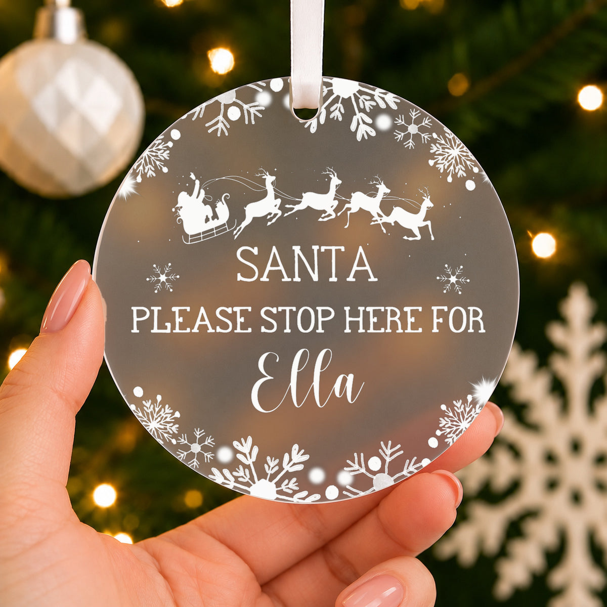 Personalised Santa Please Stop Here Christmas Bauble – Child's Name – shown held in the hand