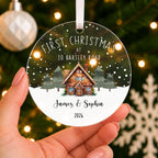 Personalised First Christmas New Home Bauble – Cottage with Your Address – shown held in the hand