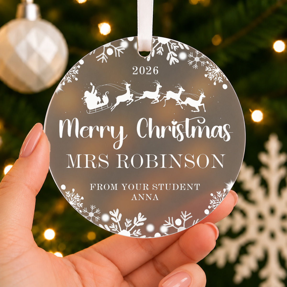 Personalised Teacher Christmas Bauble – Santa Sleigh with Name & Message – shown held in the hand