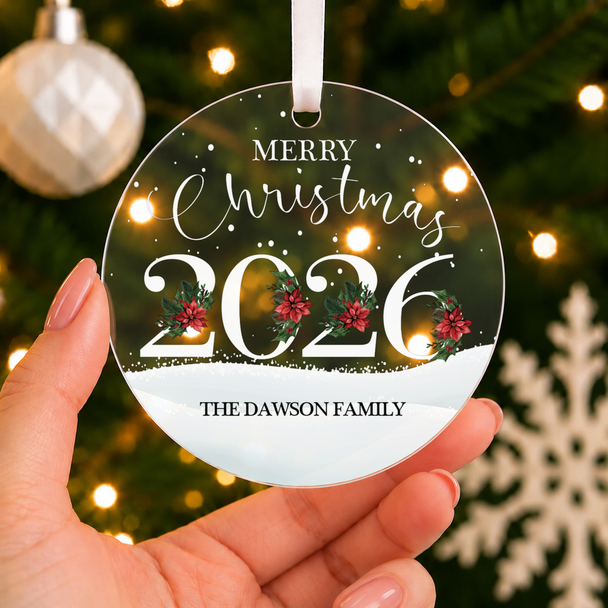 Personalised Merry Christmas Bauble 2026 – Family Name – shown held in the hand