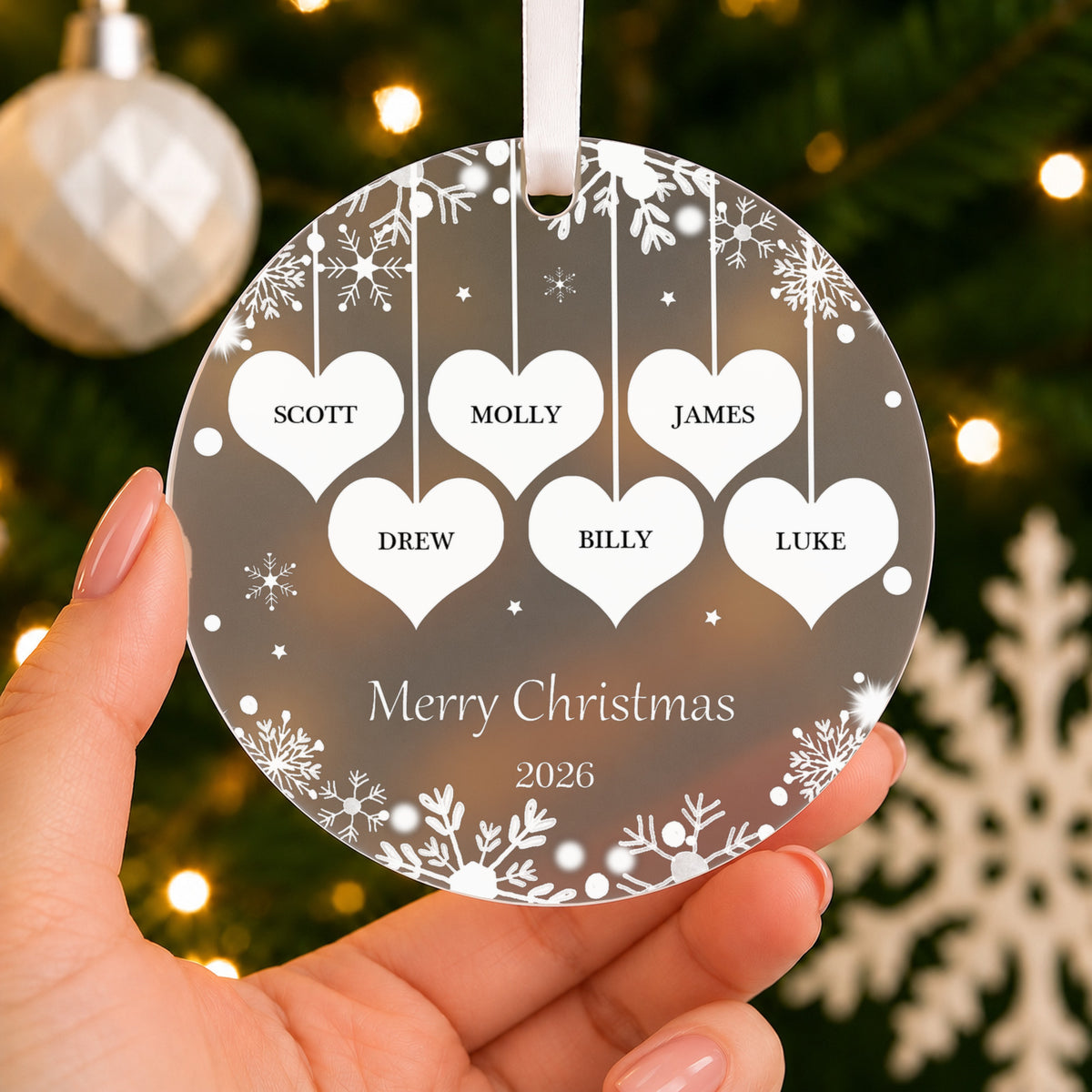 Personalised Family Hearts Christmas Bauble – 2 to 6 Names – shown held in the hand