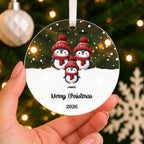Personalised Penguin Family Christmas Bauble – Family Name – shown held in the hand