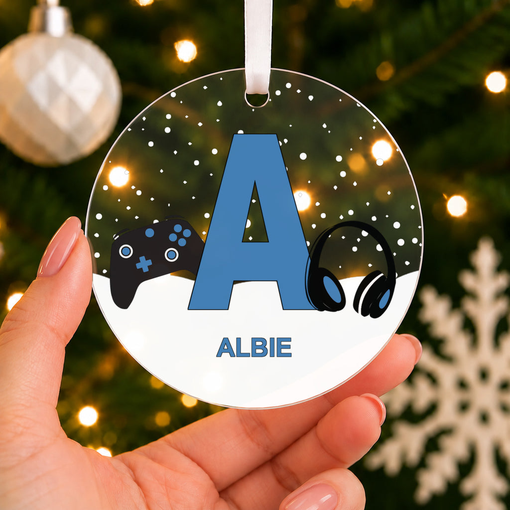 Personalised Gaming Initial Christmas Bauble – Pink, Blue, Red or Black – shown held in the hand