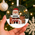 Personalised Santa & Reindeer Christmas Bauble – Child's Name – shown held in the hand