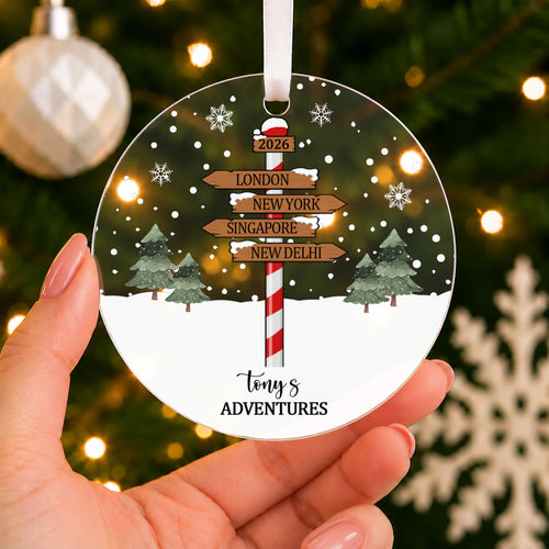 Personalised Adventures Christmas Bauble – Signpost with Your Destinations – shown held in the hand