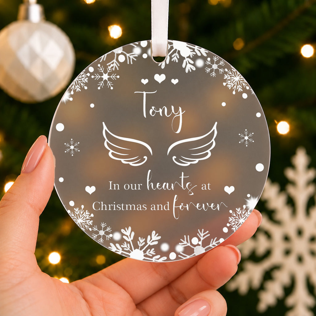 Personalised Angel Wings Memorial Christmas Bauble – In Our Hearts – shown held in the hand