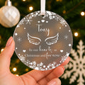 Personalised Angel Wings Memorial Christmas Bauble – In Our Hearts – shown held in the hand