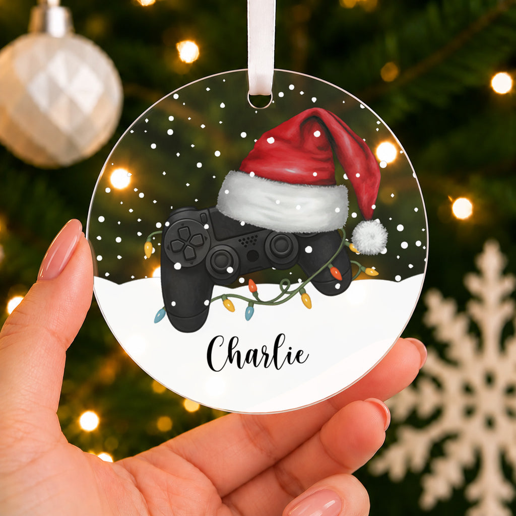 Personalised Gamer Christmas Bauble – Controller & Santa Hat with Name – shown held in the hand