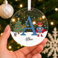 Personalised Superhero Christmas Bauble – Boy's Initial & Name – shown held in the hand