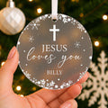 Personalised Jesus Loves You Christmas Bauble – Cross Design with Name – shown held in the hand