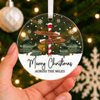 Personalised Across the Miles Christmas Bauble – Signpost Design – shown held in the hand