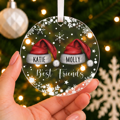 Personalised Best Friends Christmas Bauble – Santa Hats with Both Names – shown held in the hand